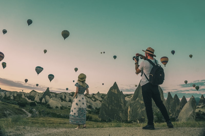 Couple watching hot air balloons in Cappadocia